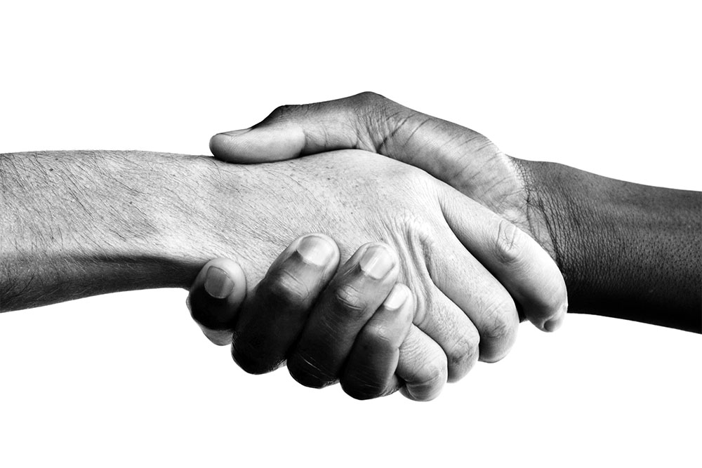 Interracial handshake